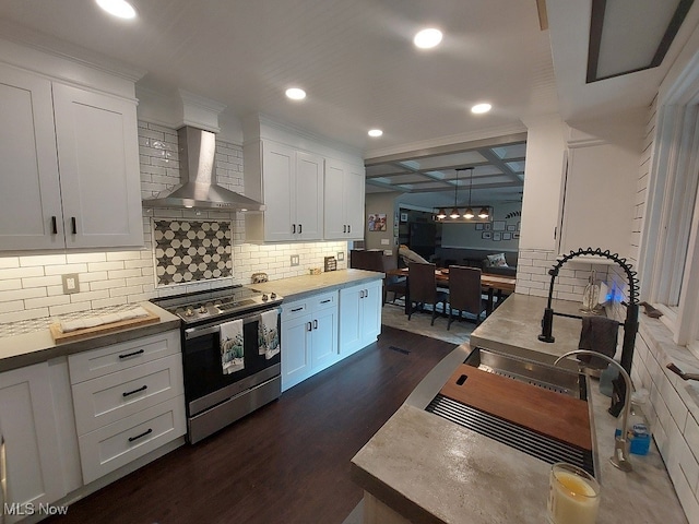 kitchen featuring white cabinets, stainless steel electric range, dark wood-type flooring, and wall chimney range hood