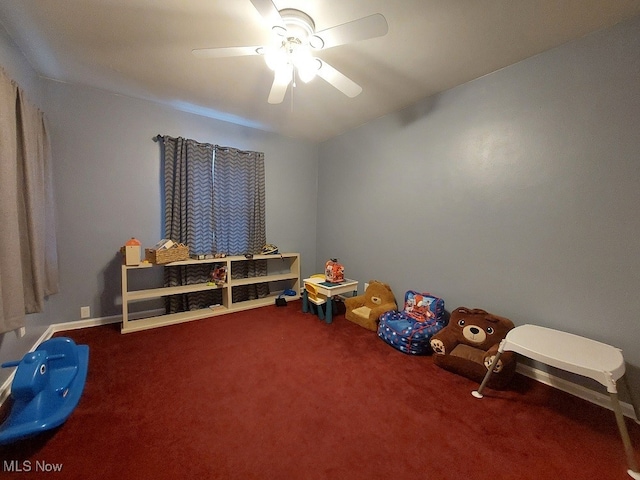 game room with ceiling fan and carpet flooring