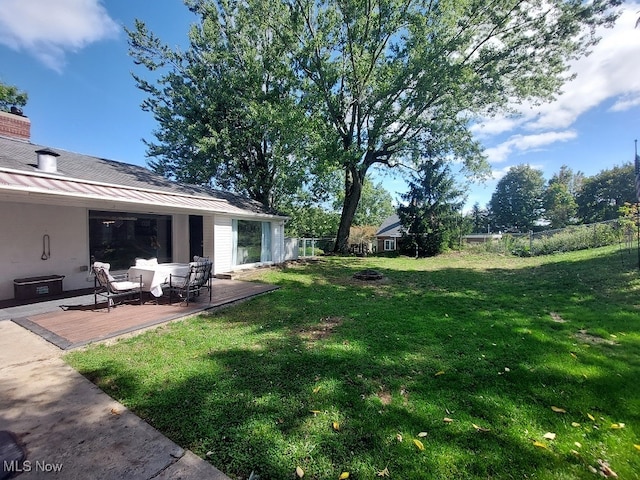 view of yard featuring a wooden deck