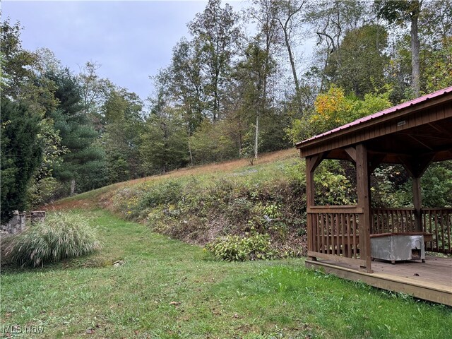 view of yard with a gazebo and a deck