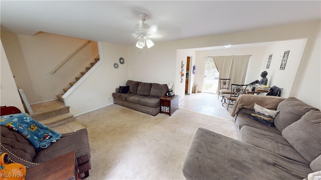 living room featuring ceiling fan and light colored carpet