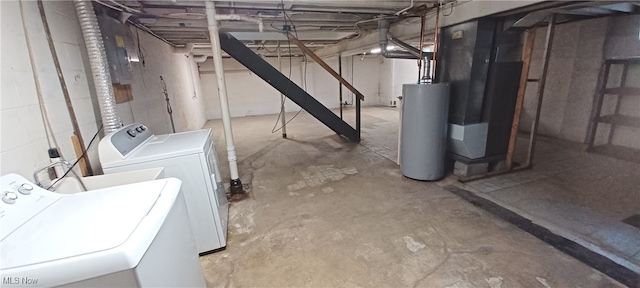 basement featuring water heater, separate washer and dryer, and heating unit