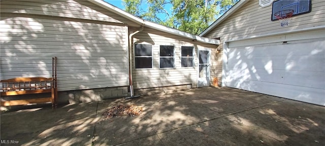 view of side of home with a garage