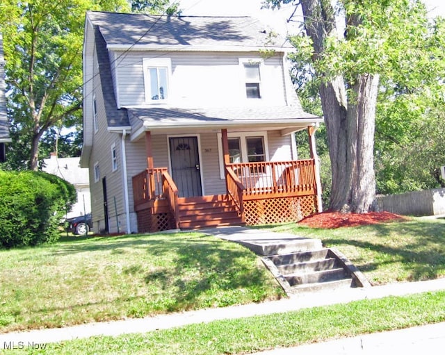 view of front of house with a porch and a front yard