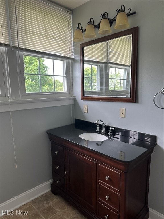 bathroom with tile patterned flooring and vanity