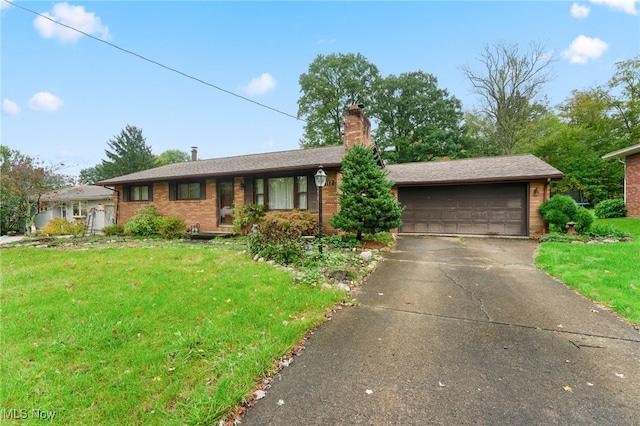 single story home with a front yard and a garage