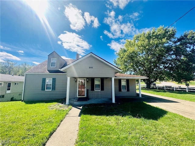 bungalow featuring a front lawn and covered porch