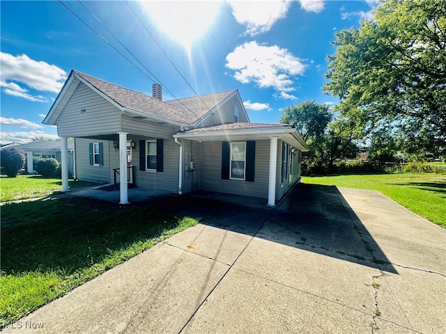 exterior space with a porch and a yard