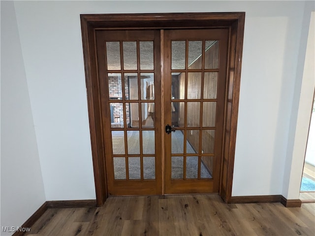 details featuring french doors and wood-type flooring