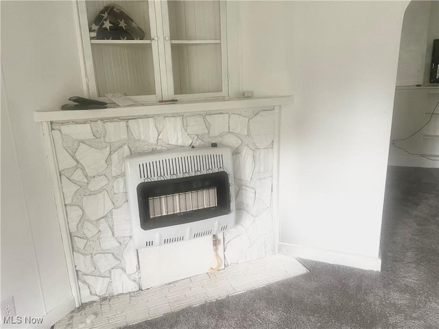 1006 Orchard St, Marietta, OH 45750 - room details with heating unit and a fireplace