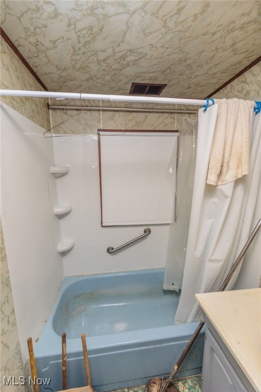 bathroom with vanity and shower / tub combo