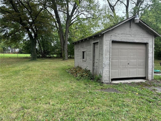 garage with a lawn