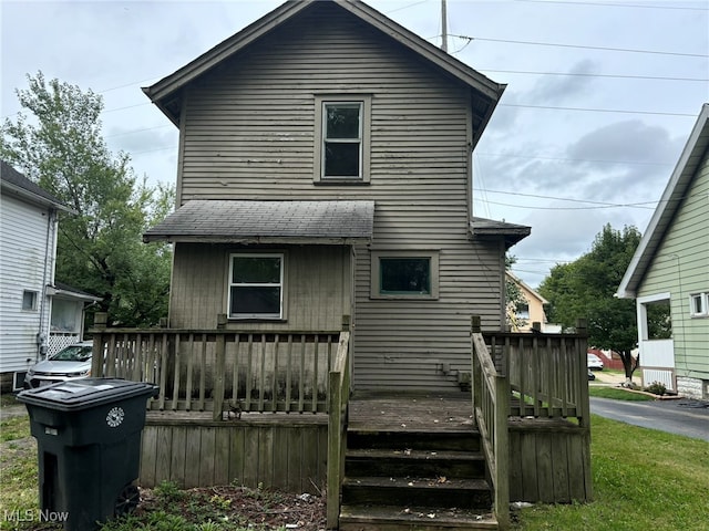 back of property with a deck