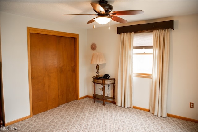 interior space with a closet and ceiling fan