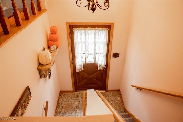 doorway featuring an inviting chandelier