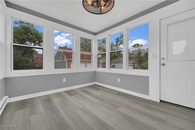 unfurnished sunroom with a healthy amount of sunlight