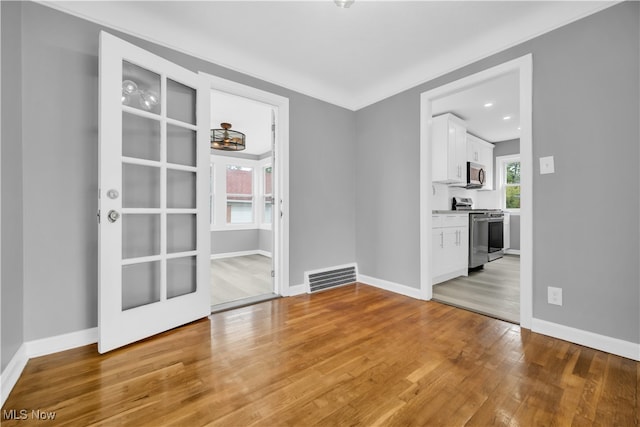 unfurnished room featuring light hardwood / wood-style flooring