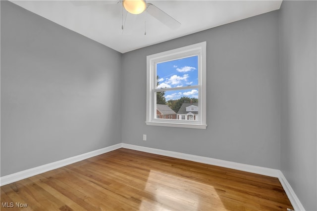 unfurnished room featuring ceiling fan and light wood-type flooring