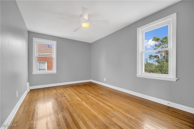 unfurnished room featuring ceiling fan and light hardwood / wood-style flooring