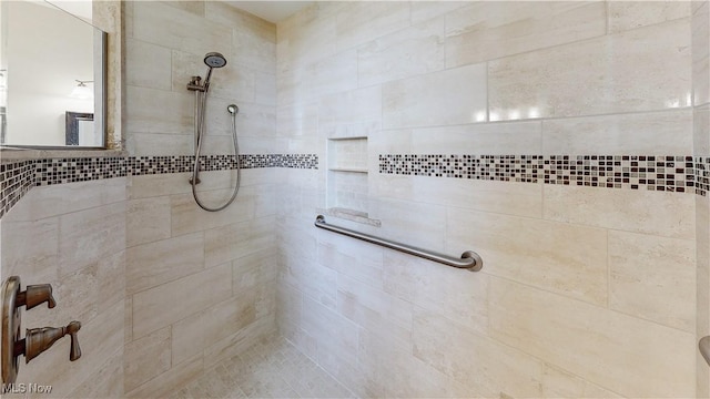 bathroom with tiled shower