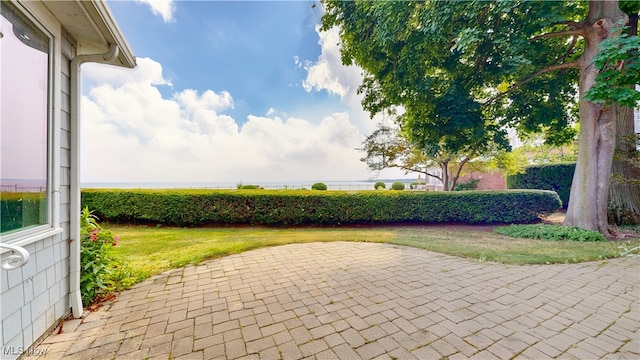 view of property's community with a patio area