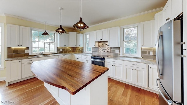 kitchen with white cabinetry and appliances with stainless steel finishes