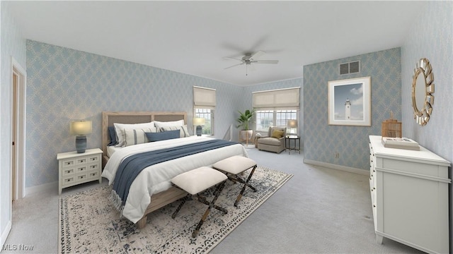 bedroom with ceiling fan and light carpet