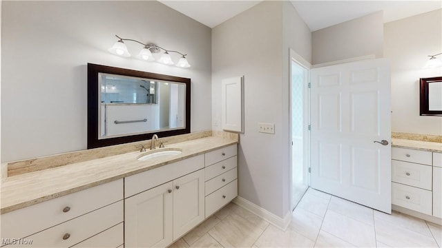 bathroom with tile patterned floors and vanity