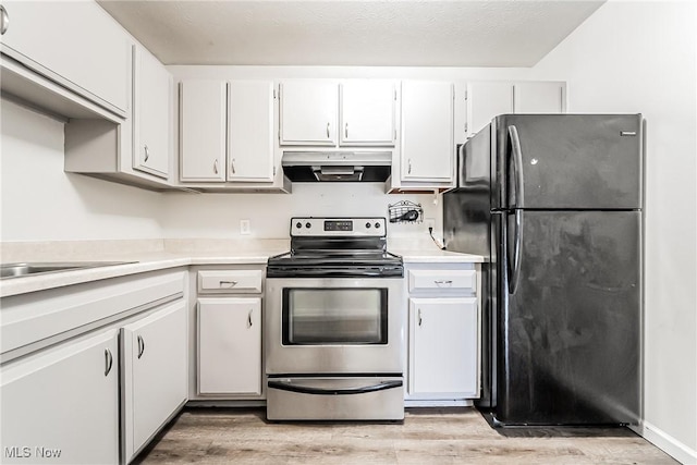 kitchen featuring white cabinetry, electric range, fridge, and light wood-type flooring