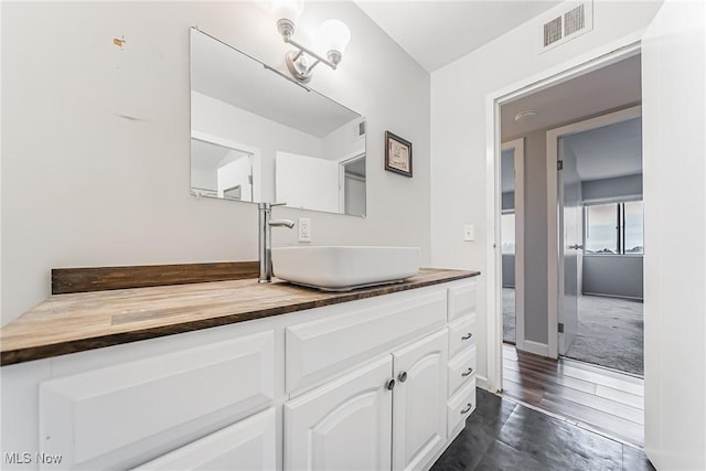 bathroom featuring wood-type flooring and vanity