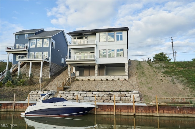 back of property featuring a balcony