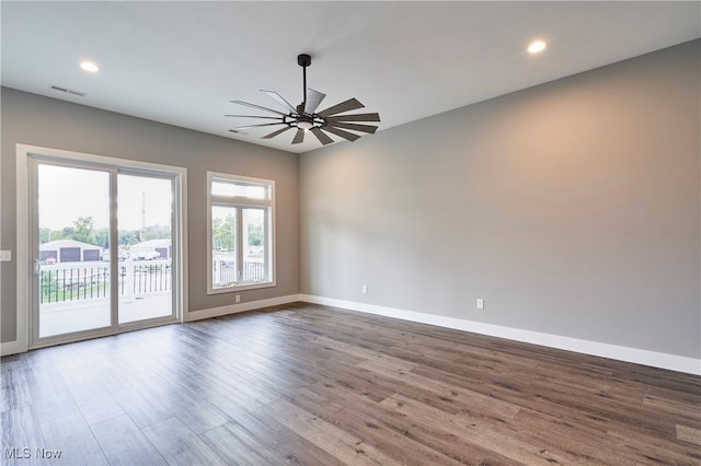 unfurnished room featuring ceiling fan and hardwood / wood-style floors