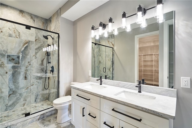 bathroom with vanity, toilet, and walk in shower