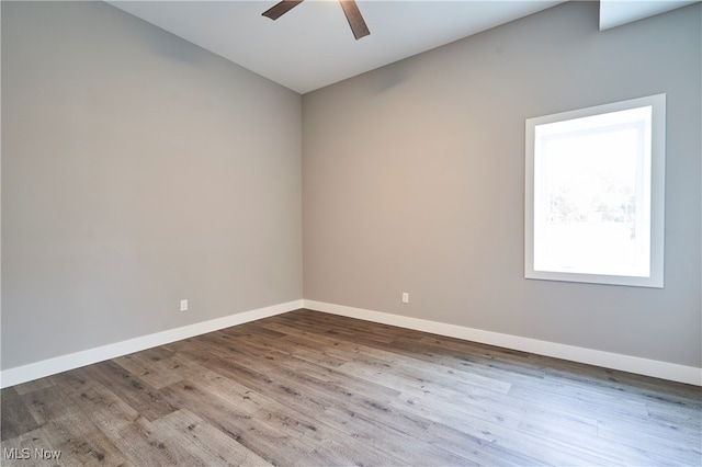 empty room featuring light hardwood / wood-style flooring and ceiling fan