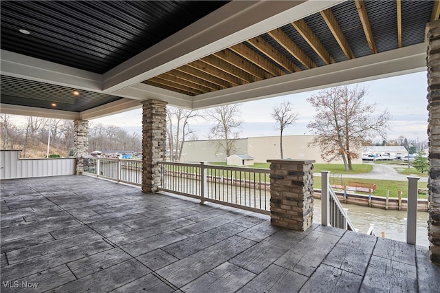 wooden deck featuring a water view