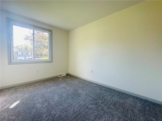 unfurnished room featuring carpet floors