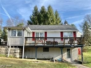 rear view of house with a wooden deck