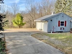 view of property exterior with a garage