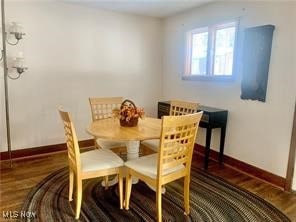 dining space featuring dark hardwood / wood-style floors