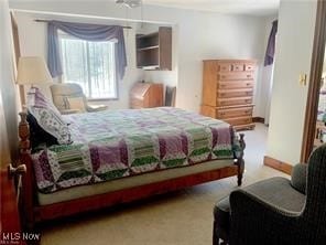 bedroom featuring light colored carpet