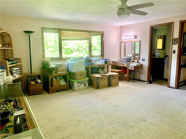 misc room featuring ceiling fan and light colored carpet