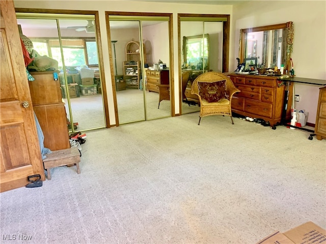 living area with light colored carpet