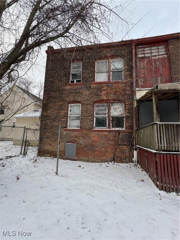 view of snow covered house