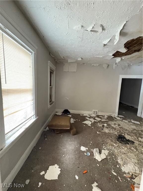 interior space with a textured ceiling