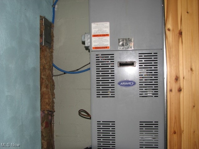 utility room with heating unit