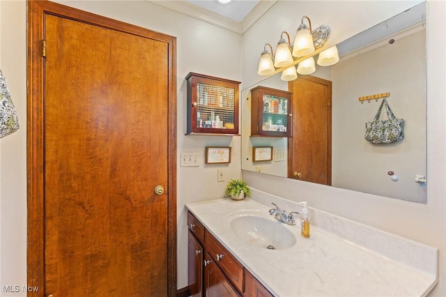 bathroom featuring vanity and crown molding