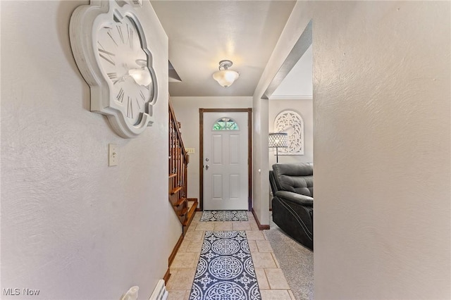 entryway with light tile patterned floors