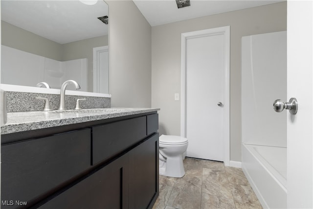 bathroom with vanity and toilet