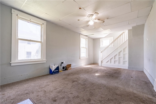 interior space featuring carpet and ceiling fan