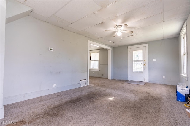 interior space with carpet floors and ceiling fan